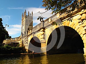 Oxford England stone bridge over river with boat